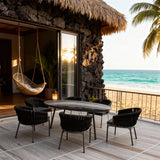 SFTZ260501 Black Woven Tropical Coastal Luxury Outdoor Dining Set with Dark Grey Cushions & Oval Glass Dining Table – Stylish Patio Furniture