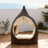 TYSF2521 Dark Brown Rattan Teardrop Outdoor Daybed with Sheer Curtains, Storage & Cream Cushions – Praslin Seychelles Coastal Terrace Luxury Private Outdoor Canopy Daybed