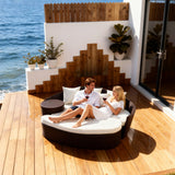 TYSF2577 Cream Rattan Curved Outdoor Sofa with Fiery Red Cushions & Side Table – Rio de Janeiro Brazil Coastal Terrace Luxury Vibrant Outdoor Curved Sofa