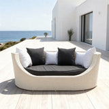 TYSF2603 White Rattan Round Enclosed Outdoor Sofa with Dark Grey Cushions & Black-White Pillows – Santorini Greece Coastal Terrace Luxury Private Outdoor Round Sofa