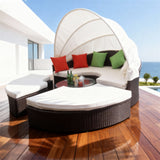 TYSF2606 Black Rattan Round Enclosed Outdoor Daybed with White Canopy, Center Bar & Red-Green Pillows – Los Cabos Mexico Coastal Terrace Luxury Vibrant Outdoor Round Daybed
