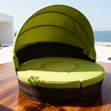 TYSF2606 Black Rattan Round Enclosed Outdoor Daybed with White Canopy, Center Bar & Red-Green Pillows – Los Cabos Mexico Coastal Terrace Luxury Vibrant Outdoor Round Daybed