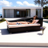 TYSF2609 Black Rattan Wave-Shaped Single Outdoor Chaise Lounge with Cream Cushions & Blush Pillow – Algarve Portugal Coastal Terrace Luxury Relaxed Outdoor Chaise